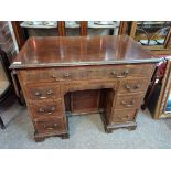 Antique mahogany knee hole desk with side flaps