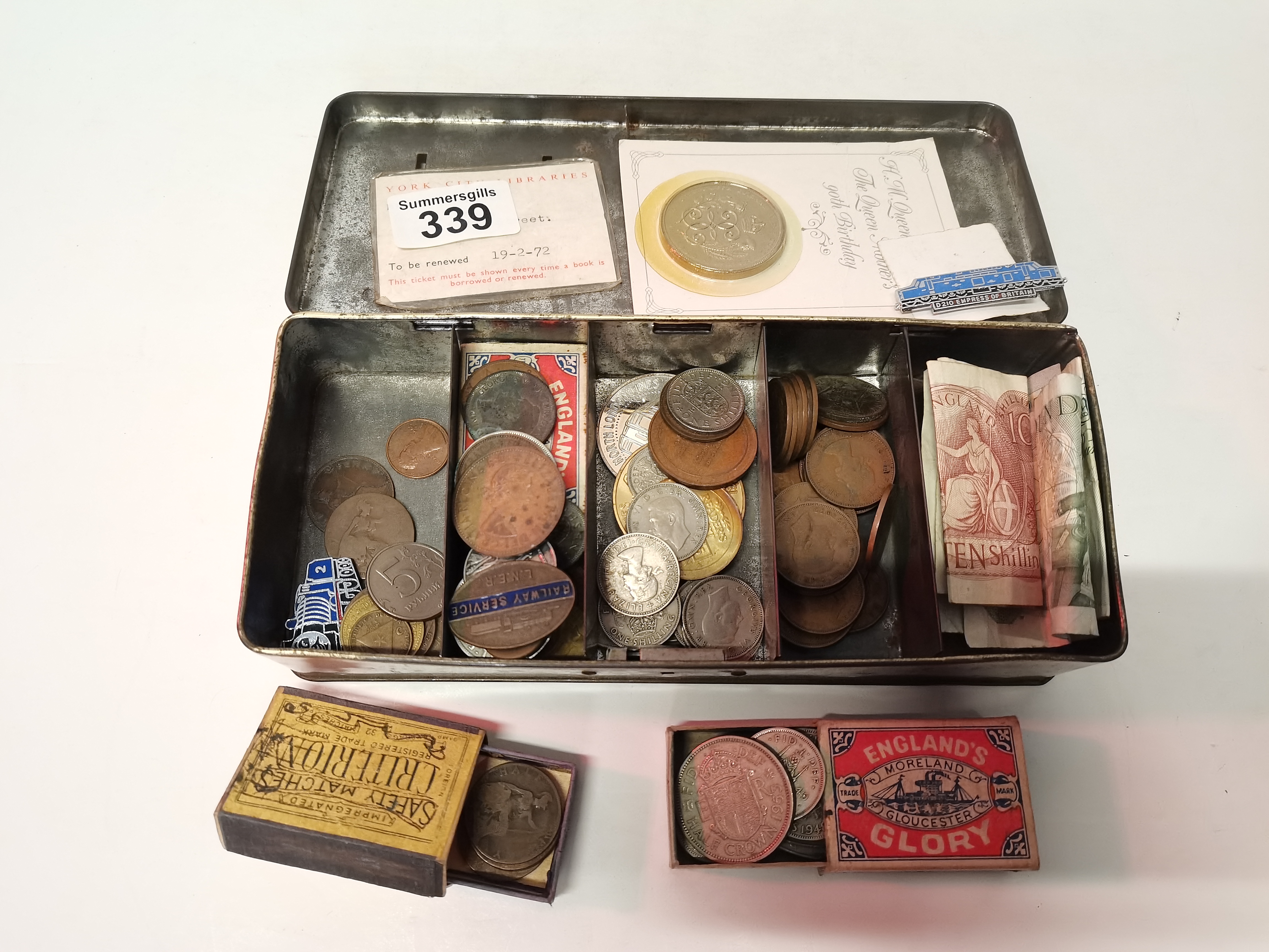 Selection of coins, money in tin box
