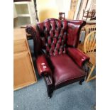 Queen Anne button back maroon leather armchair