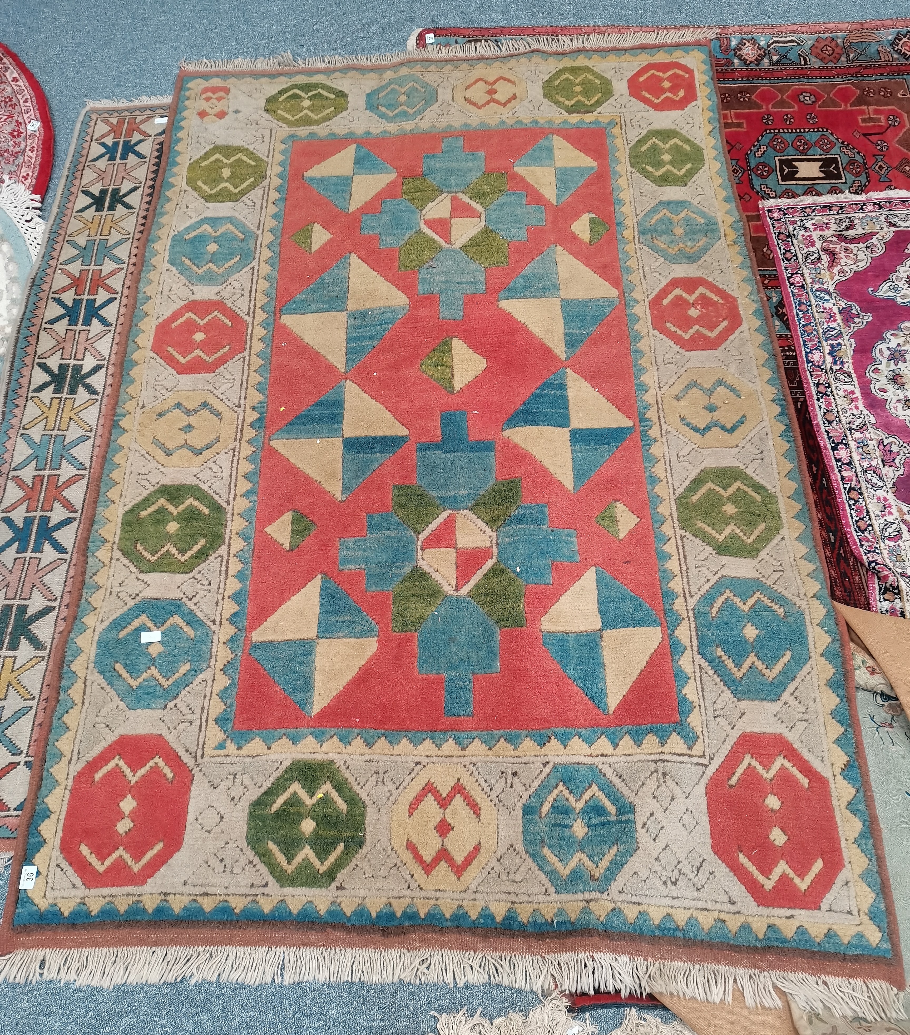 Red, Blue and cream faded rug 250 x 155