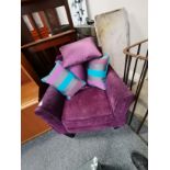Purple armchair and cushions