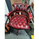 Red leather button back swivel chair