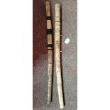 A near pair of oriental Samuri style bone carved swords