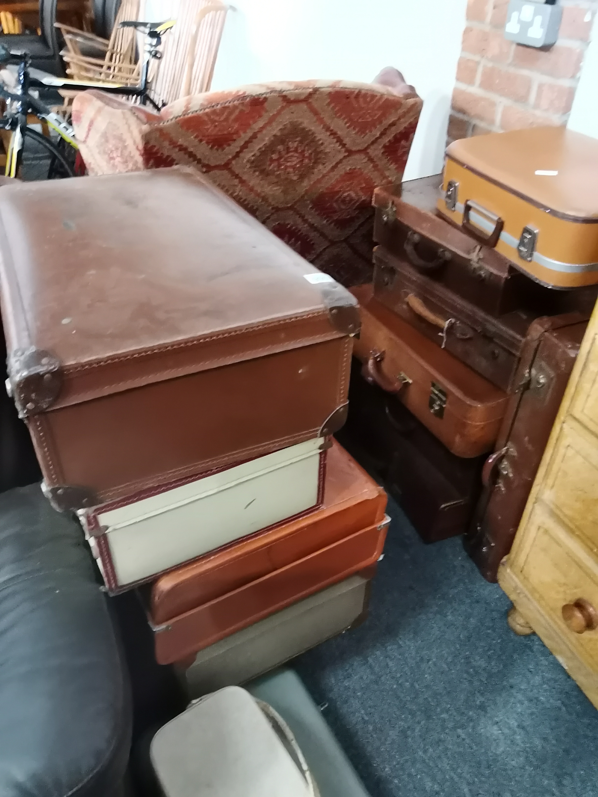 Collection of leather and other suite cases