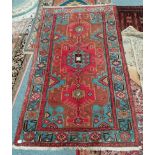 red and blue rug with some fading 225 x 130