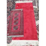 Red rug good condition 100 x 52, Red rug with cream trim on short edge good condition 160 x 78