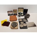 Selection of cuff links, coins cigarette lighters