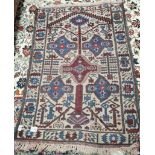 Blue and maroon rug, condition worn 120 x 92