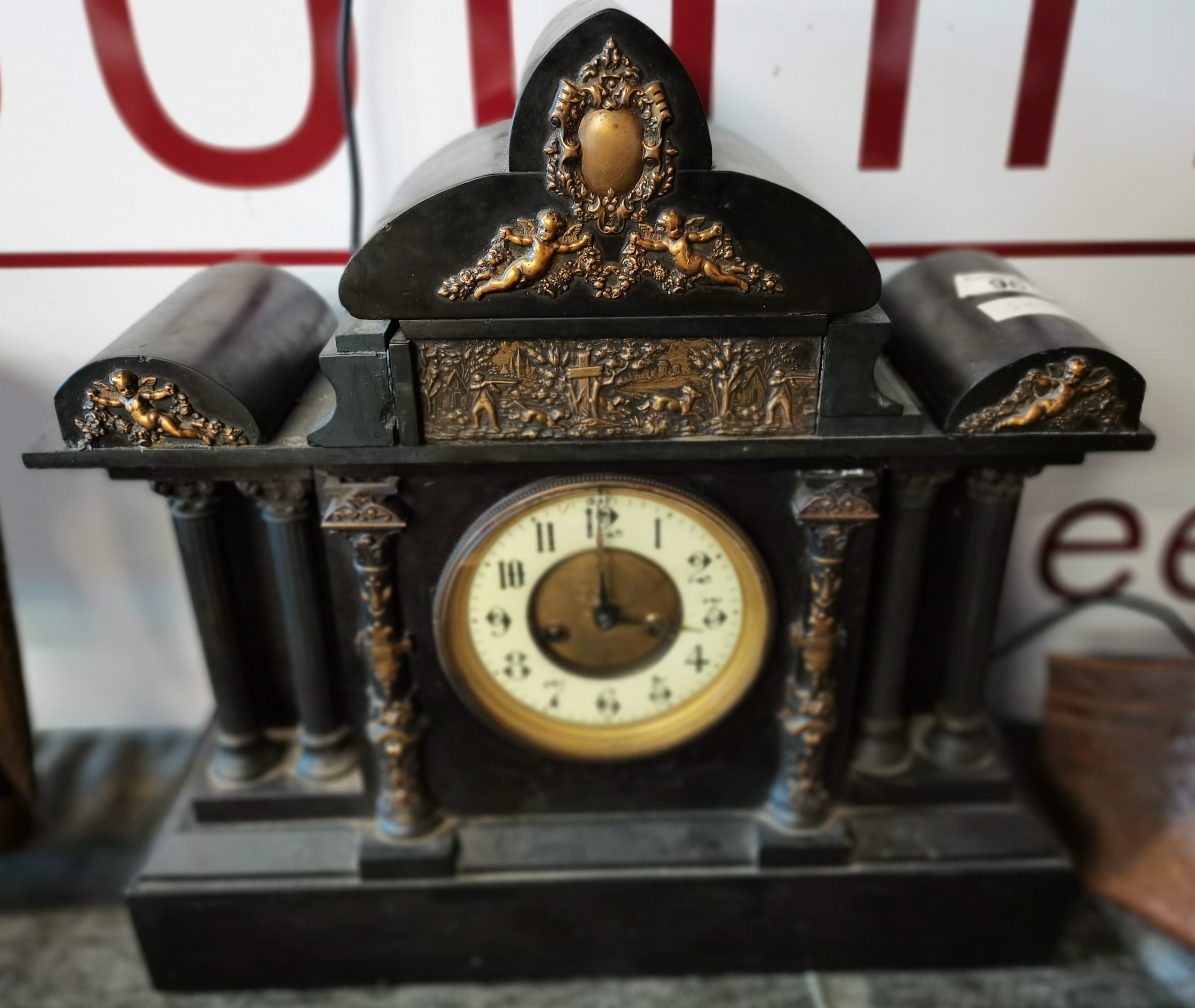 Black Mantle Clock with cherub decoration