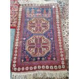 Red and Blue rug condition faded on one side 130 x 84