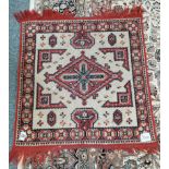 Red and cream rug 70 x 67