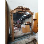 Antique large gilt mirror with swags and tails decoration