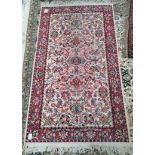 Red and cream faded rug 140 x 80