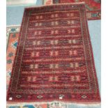 Red and blue rug has some fading and wear 210 x 140