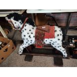 Antique wooden rocking horse with later fur decoration