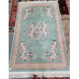 Green and pale pink rug with dragons 190 x 125 Very good condition