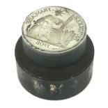 A CONTINENTAL WHITE METAL DESK SEAL Having an intaglio cast figural coin featuring a seated figure