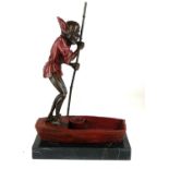 A COLD PAINTED BRONZE STATUE GOBLIN IN BOAT On black marble base. (36cm) Condition: good