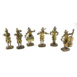 A 19TH CENTURY CONTINENTAL SILVER GILT AND PASTE NOVELTY MUSICAL BAND, A GROUP OF SIX MUSICIAN