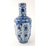 A CHINESE PORCELAIN BLUE AND WHITE VASE With fluted panels and hand painted floral decoration,