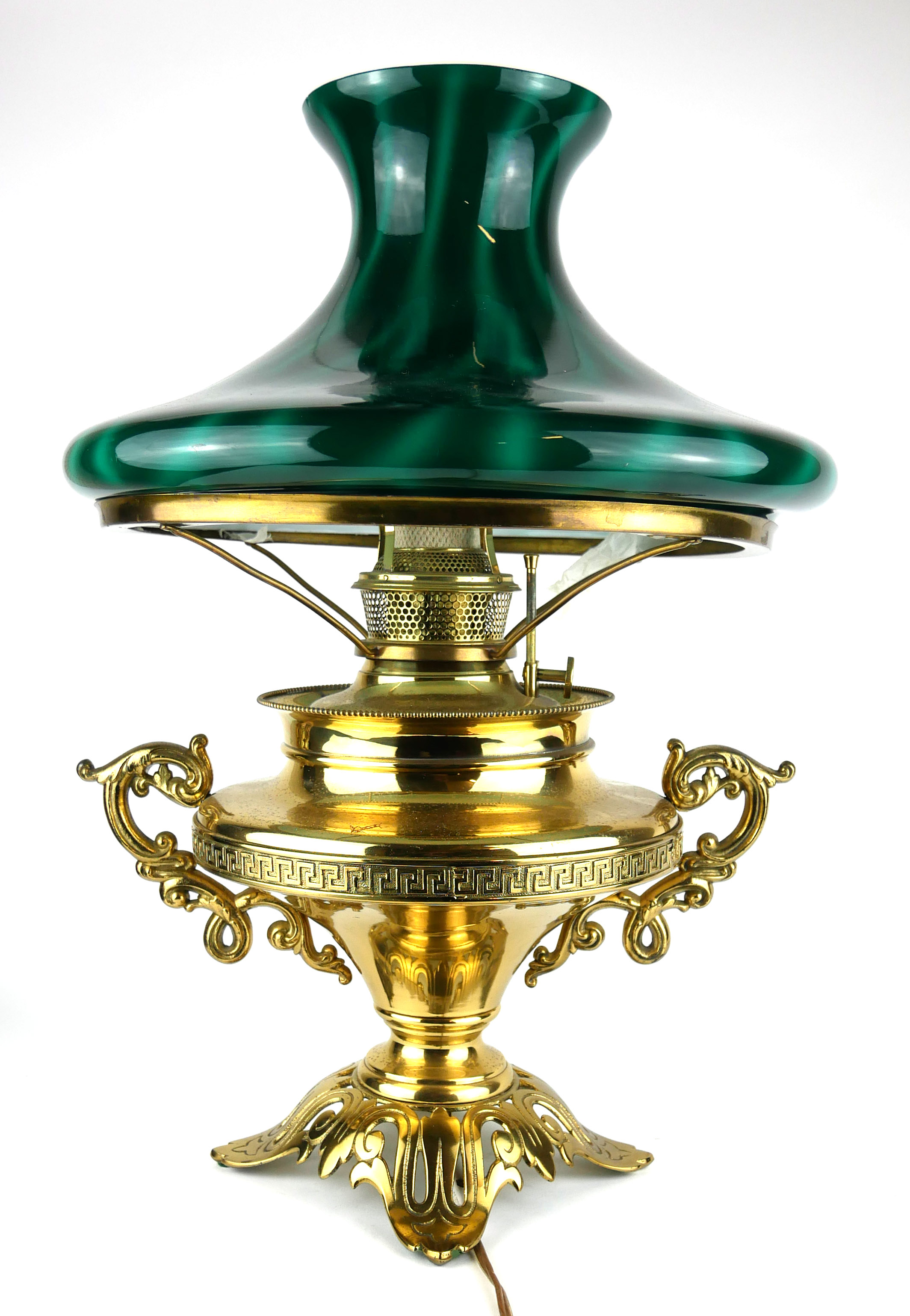 A LATE 19TH/EARLY 20TH CENTURY BRASS AND GREEN GLASS TABLE LAMP Having a circular green glass shade,