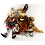 A COLLECTION OF THEATRICAL PAPIER-MACHÉ DOLLS Comprising a Jester hanging bag with purple and gold