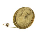 A 19TH CENTURY ITALIAN LAVA CAMEO The oval classical portrait carved in high relief, in a gold