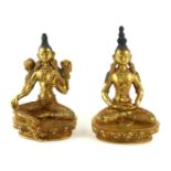 TWO CHINESE GILT BRONZE TARA GODDESS BUDDHA FIGURES Seated pose with flowers set to shoulders and
