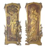 A PAIR OF CONTINENTAL ART NOUVEAU CAST IRON FIGURAL PLAQUES Female form with organic decoration,