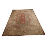 A LARGE TURKISH MILAS TABAN WOOLLEN RUG OF CARPET PROPORTIONS Three geometric motifs to central