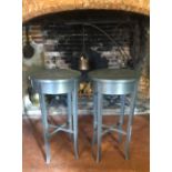 A PAIR OF CONTEMPORARY GALVANISED STEEL OCCASIONAL TABLES. (diameter 45cm x 80cm)