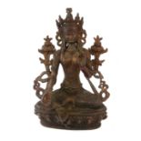 A TIBETAN BRONZE LAKSHMI BUDDHA FIGURE Seated pose flanked by two lotus flowers. (approx 23cm)
