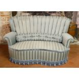 AN ART DECO DESIGN KIDNEY FORM TWO SEATER WINDOW SETTEE With shell back, in pale green fabric