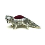A STERLING SILVER NOVELTY 'FOX' PIN CUSHION Having a red velvet cushion. (approx 6cm)