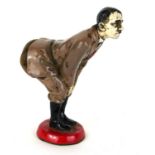 A COLD PAINTED METAL NOVELTY 'HITLER' PIN CUSHION Having a velvet cushion set to rear. (approx 12cm)