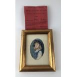 FLORA TOMKINS, 1872 - 1960, OVAL MINIATURE ON IVORY Portrait of a young lady wearing a blue dress,