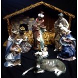 LLADRO, A PORCELAIN PART NATIVITY GROUP Joseph, Mary, Jesus, three Kings and a donkey, together with