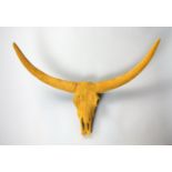 A 21ST CENTURY DECORATIVE RESIN OX SKULL & HORNS WITH SUEDE EFFECT (h 59cm x w 70cm x d 35cm)