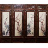 A SET OF FOUR CHINESE PORCELAIN PLAQUES Decorated with birds amongst flora, in a decorative
