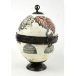 AN OSTRICH EGG Decorated with the big five: rhinoceros, lion, buffalo, leopard and elephant. (20cm)