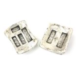 TWO CHINESE WHITE METAL INGOT TOKENS Square form with embossed chinese inscriptions.