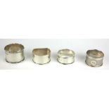 A COLLECTION OF FOUR EARLY 20TH CENTURY SILVER SERVIETTE RINGS Various form including a 'D' shape