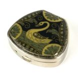 A VINTAGE WHITE METAL AND ENAMEL PILL BOX Decorated with a swan design on a black ground. (approx