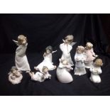 LLADRO, A COLLECTION OF NINE PORCELAIN ANGEL FIGURINES Including three in standing pose, one playing