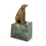 AN ART DECO BRONZE SCULPTURE OF A POLAR BEAR having square form features, on a green marble
