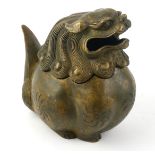 A CHINESE BRONZE TEMPLE LION FORM CENSOR The figural lid having a scrolled mane and pierced mouth,