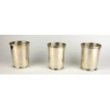 A COLLECTION OF THREE STERLING SILVER BEAKERS Each having a different design to rim, one marked '