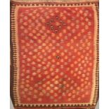 A LARGE KELIM RUG The central field in the form of stylized trees on a red ground, along with