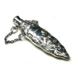 A STERLING SILVER PERFUME BOTTLE Having embossed decoration with hanging chain. (approx 7cm)