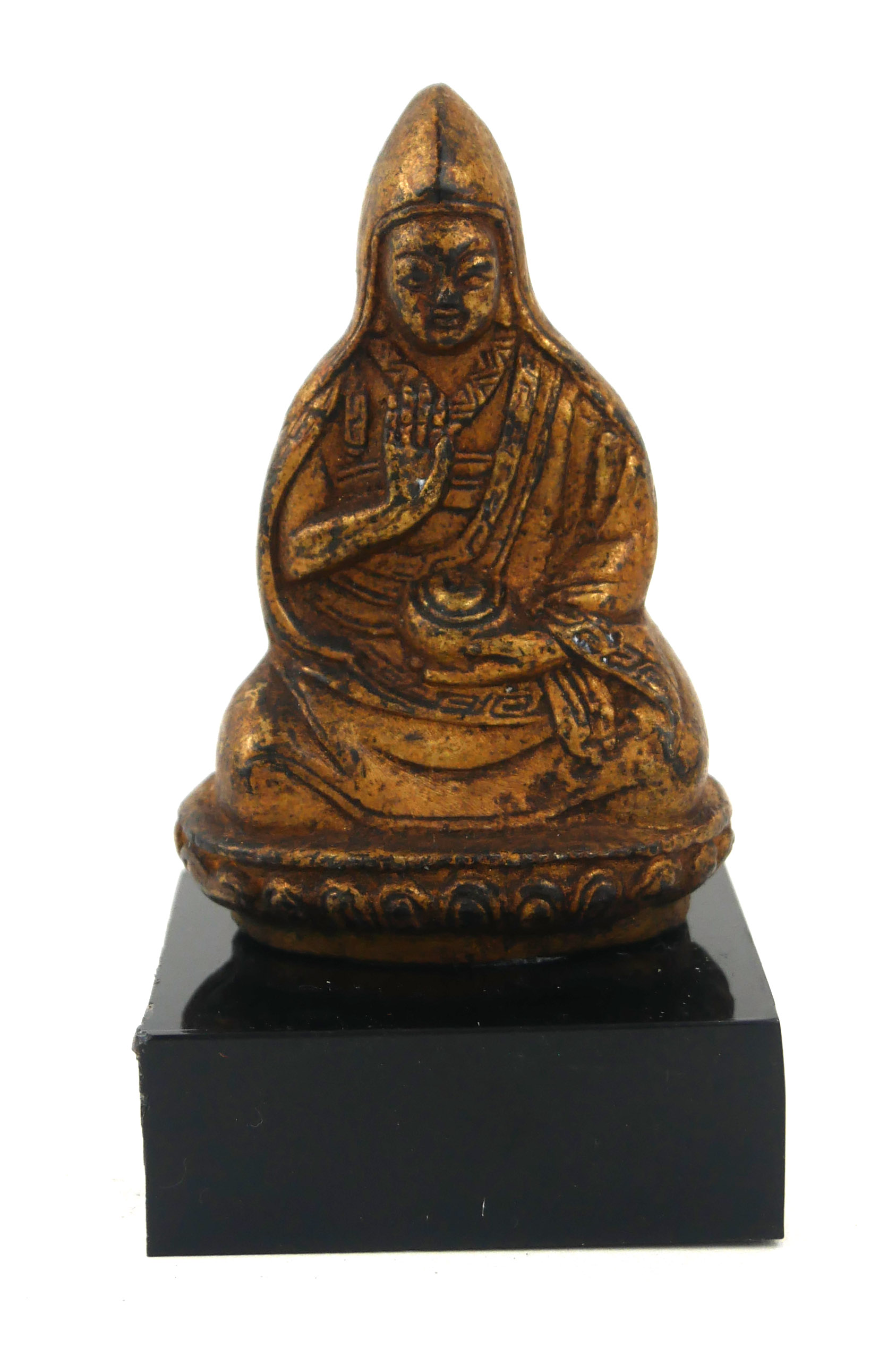 A CHINESE GILT BRONZE BUDDHA Seated pose holding an urn on black perspex base. (Buddha approx 6.7cm)